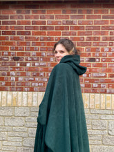 Load image into Gallery viewer, Girl wearing a green hooded blanket scout camp blanket badge blanket with pocket