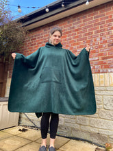 Load image into Gallery viewer, Girl wearing a green hooded blanket scout camp blanket badge blanket with pocket