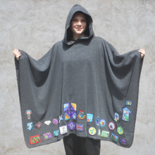 Load image into Gallery viewer, Girl wearing grey hooded blanket camp blanket badge blanket with scout badges sewn on