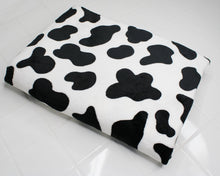 Load image into Gallery viewer, Cow print fleece fabric to be made into hooded blanket
