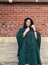 Load image into Gallery viewer, Girl wearing a green hooded blanket scout camp blanket badge blanket with pocket
