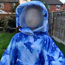 Load image into Gallery viewer, Child mannequin wearing a hooded blanket made from a sky design printed fleece with front pocket
