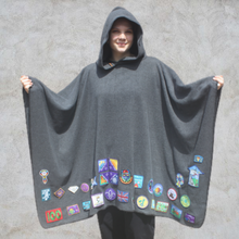Load image into Gallery viewer, Girl wearing grey hooded blanket camp blanket badge blanket with scout badges sewn on
